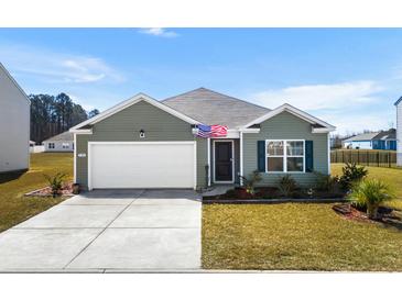 Charming one-story home boasts a well-manicured lawn, single garage, and welcoming front entrance at 520 Combine Dr., Conway, SC 29527