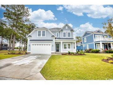 Charming two-story home with a manicured lawn and inviting curb appeal at 641 Waterbridge Blvd., Myrtle Beach, SC 29579