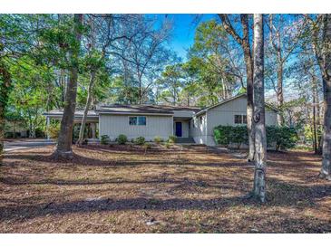 Charming single story home with lush, mature landscaping and a covered parking area at 935 Little Creek Rd., Myrtle Beach, SC 29572