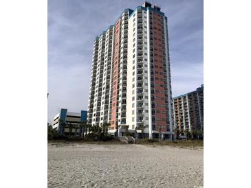 High-rise condo building with a beach view and exterior balconies on a partially cloudy day at 1605 S Ocean Blvd. # 106, Myrtle Beach, SC 29577