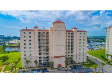 Stunning exterior view of a multi-story building with beautiful architectural design and a red tile roof at 2151 Bridge View Ct. # 2-902, North Myrtle Beach, SC 29582