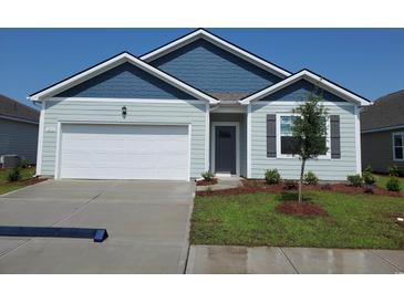 Charming one-story home featuring a two-car garage, lovely landscaping, and a light blue facade at 2832 Riverboat Way, Conway, SC 29526