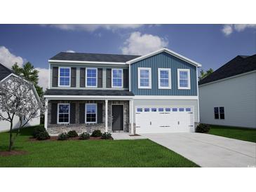 Two-story home featuring stone accents, a two-car garage, and a well-manicured front lawn at 615 St. Albans Loop, Conway, SC 29526