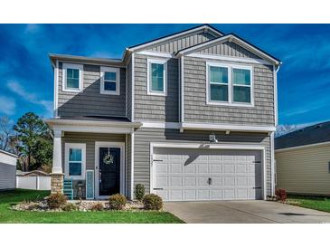 Charming two-story home with gray siding, white trim, and a welcoming front porch at 1527 Swing Bridge Way, Myrtle Beach, SC 29588