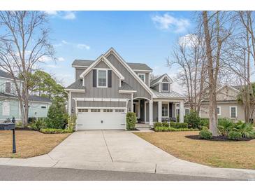 Charming two-story home with a manicured front yard and a two-car garage at 2409 Silkgrass Ln., Myrtle Beach, SC 29579