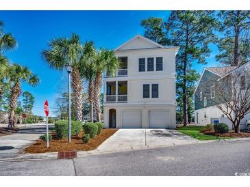 Charming three-story home with dual garage, double balconies and lush landscaping at 4762 Cloister Ln., Myrtle Beach, SC 29577