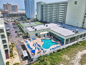 Aerial view of a blue swimming pool with lounge chairs at Sands Beach Club at 9400 Shore Dr. # 728, Myrtle Beach, SC 29572