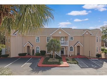Attractive condo building with well maintained landscaping and reserved parking spots at 340 Lands End Blvd. # 18, Myrtle Beach, SC 29572