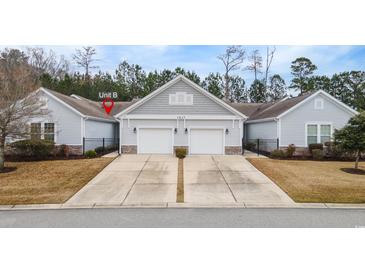 Charming home featuring a two-car garage, well-manicured lawn, and welcoming curb appeal at 1517 Palmina Loop # B, Myrtle Beach, SC 29588