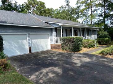 Charming single-story home with a two-car garage, covered porch, and well-maintained landscaping at 228 Lander Dr., Conway, SC 29526