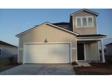 Charming two-story home with a large garage, light-colored siding, and a welcoming front entrance at 444 Ribbon Rail Way, Loris, SC 29569