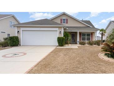 Charming single-story home features a two-car garage and a well-manicured front yard at 654 Old Castle Loop, Myrtle Beach, SC 29579