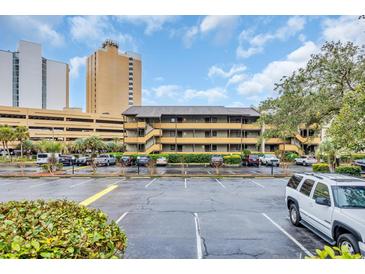 Exterior of condo building with parking lot and multiple floors at 9501 Shore Dr. # D-234, Myrtle Beach, SC 29572