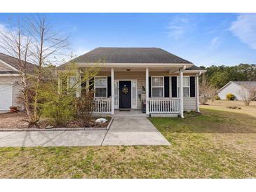 Charming single-story home features a cozy front porch with black shutters and a walkway leading to the entrance at 113 Cat Tail Bay Dr., Conway, SC 29527