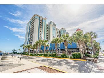 Beautiful exterior view of a multi-story building surrounded by landscaped palms against a clear sky at 2401 S Ocean Blvd. # 1260, Myrtle Beach, SC 29577
