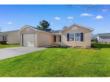Charming single-story home with a well-maintained lawn and attached one car garage at 2483 Morlynn Dr., Myrtle Beach, SC 29577
