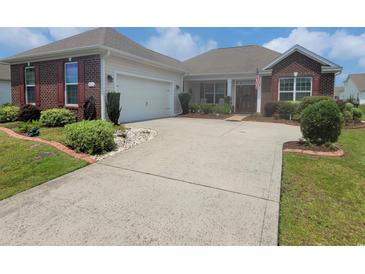Charming single-story home with brick accents, manicured landscaping, and a wide driveway at 5318 Tremiti Ln., Myrtle Beach, SC 29579