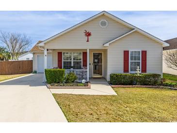 Charming single-story home with a well-manicured lawn and inviting front porch at 8091 Bark Ct., Murrells Inlet, SC 29576