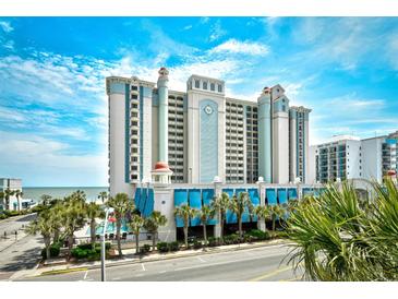 A beautiful exterior view of an oceanfront resort showcasing its architecture, pool, and beachfront access at 2401 S Ocean Blvd. # 859, Myrtle Beach, SC 29577