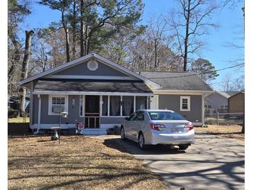 Charming single-story home featuring a gray exterior, well-kept yard, and a driveway with parking at 330 Fairwood Terrace, Myrtle Beach, SC 29588