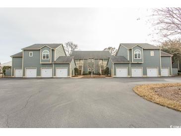 Charming townhome complex with individual garages and private entrances, nestled in a peaceful community setting at 820 Castleford Circle # 6-G, Myrtle Beach, SC 29572