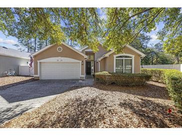 Charming one-story home with a two-car garage and well-maintained landscaping at 1201 Trisail Ln, North Myrtle Beach, SC 29582