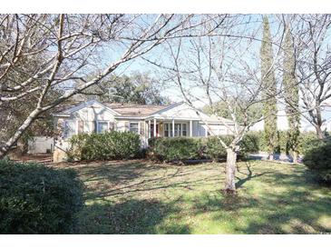 Charming single-story home with mature landscaping in the front yard at 1841 Jasper St., Georgetown, SC 29440