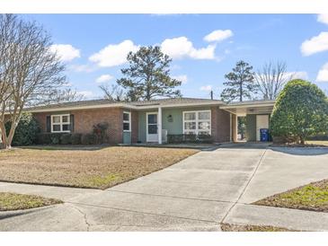 Charming one-story home with brick accents, long driveway, and well-maintained lawn at 3727 Otter St., Myrtle Beach, SC 29577