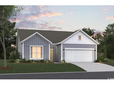 Charming single-story home with a two-car garage, landscaped yard, and inviting curb appeal at 374 Kapalua Loop, Little River, SC 29566