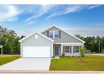 Charming single-Gathering home with manicured lawn, a two-car garage and inviting curb appeal at 491 Wagner Cir., Conway, SC 29526