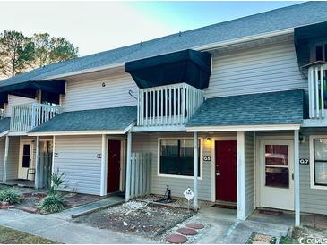 Two-story condos featuring balconies, gray siding and dark shingled roofs at 801 Burcale Rd. # G-5, Myrtle Beach, SC 29579