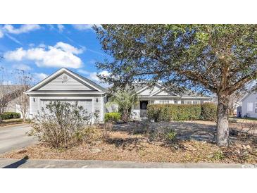 Charming single-story home featuring a well-maintained lawn and a two-car garage at 1032 Cadbury Ct., Conway, SC 29527