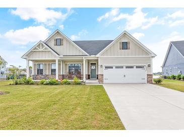 Charming single Gathering home with a well-manicured lawn, covered porch, and attached two car garage at 2609 Turchino Ct., Myrtle Beach, SC 29579