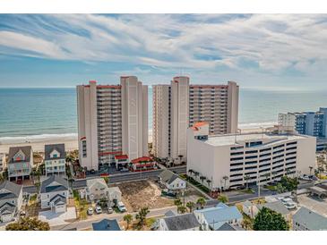Aerial view of two beachfront condo towers, showcasing architecture, beach access, and nearby street at 1625 S Ocean Blvd. # 1004, North Myrtle Beach, SC 29582