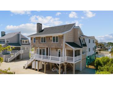 Charming beach home with a neutral color palette, white trim, deck, and low-maintenance yard at 206B 56Th Ave. N, North Myrtle Beach, SC 29582