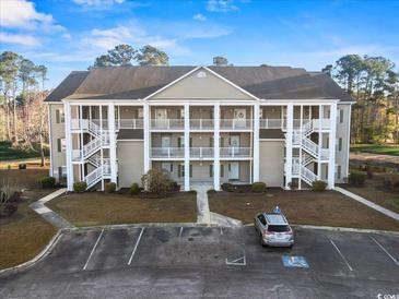 Attractive three-story condo with white columns, multiple balconies and ample parking at 5834 Longwood Dr. # 303, Murrells Inlet, SC 29576
