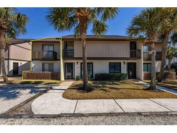 Charming two-story townhome featuring a private balcony and brick accents at 10200 Lake Shore Dr. # 16, Myrtle Beach, SC 29572