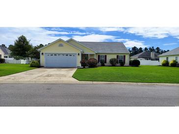 Charming single story home with a well manicured front lawn and attached garage at 724 Alexis Dr., Longs, SC 29568