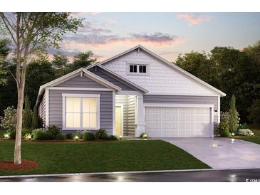 Charming single-Gathering home with a two-car garage, beautiful landscaping, and a well-manicured lawn at 759 Wailea Circle, Little River, SC 29566