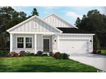 Charming single-story home featuring a two-car garage, inviting front porch, and manicured lawn at 3019 Dover Branch Dr., Little River, SC 29566