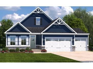 Charming two-story home featuring a blue exterior, white trim, stone accents, and a spacious two-car garage at 7019 Denim Loop, Myrtle Beach, SC 29579