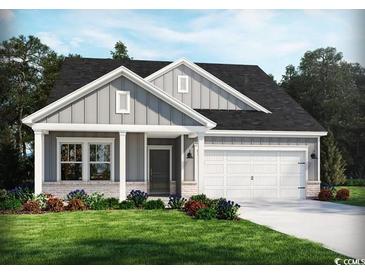 Charming single-Gathering home boasting stone accents, lush landscaping, and a two-car garage at 929 Maya Layne Dr., Little River, SC 29566