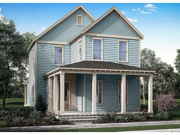 Charming two-story blue home with a welcoming front porch and classic architectural details at 1587 Sayebrook Pkwy., Myrtle Beach, SC 29588