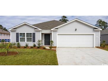 Charming single-story home featuring a well-manicured lawn, attached garage and classic curb appeal at 178 Ashworth Dr., Tabor City, NC 28463