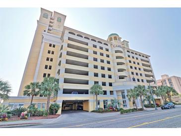 Camelot By The Sea resort featuring multi-level parking, palm trees, and lovely landscaping at 2000 N Ocean Blvd. # 1509, Myrtle Beach, SC 29577