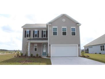 Charming two-story home with neutral siding, attached garage, and a well-maintained front lawn at 6055 Forest Dell Ct, Myrtle Beach, SC 29579
