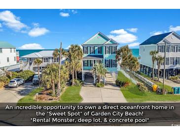 Charming oceanfront home with a deep lot, concrete pool and ample parking at 885 S Waccamaw Dr., Garden City Beach, SC 29576