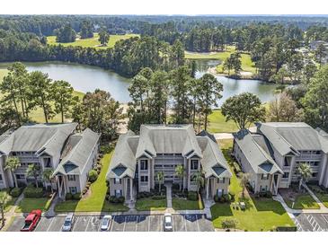 Beautiful condo complex with manicured landscaping, golf course and a large pond in a scenic setting at 298 Pinehurst Ln. # 10-J, Pawleys Island, SC 29585