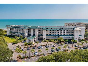 Expansive resort complex boasting oceanfront access, lush landscaping, and ample parking at 601 Retreat Beach Circle # 411, Pawleys Island, SC 29585