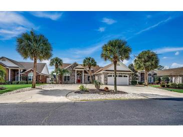 Charming single-story home with lush landscaping, stone accents, and a convenient two-car garage at 639 Tarrant St., Longs, SC 29568